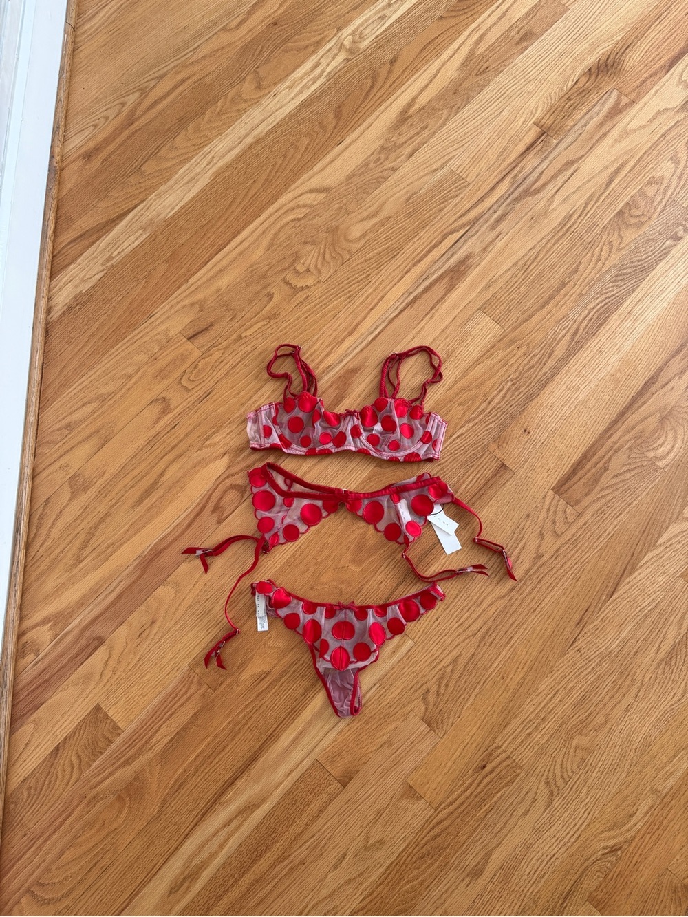 Fleur Du Mal 3pc polka dot lingerie set with bra, garter belt, and thong.
